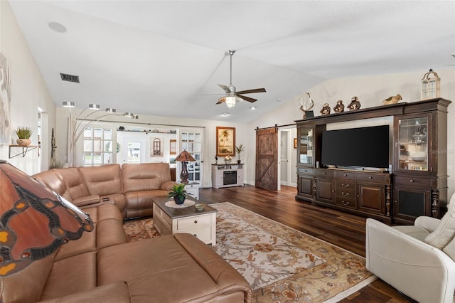 425 Corrientes Cir, Punta Gorda, FL 33983 - living area with ceiling fan, lofted ceiling, dark wood finished floors, a barn door, and baseboards