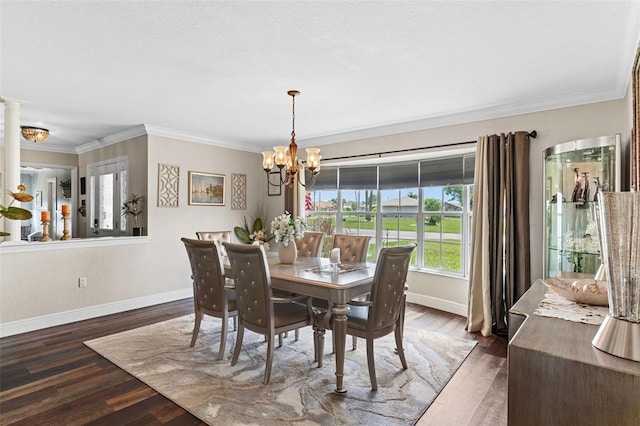 425 Corrientes Cir, Punta Gorda, FL 33983 - dining space with a chandelier, baseboards, crown molding, and wood finished floors