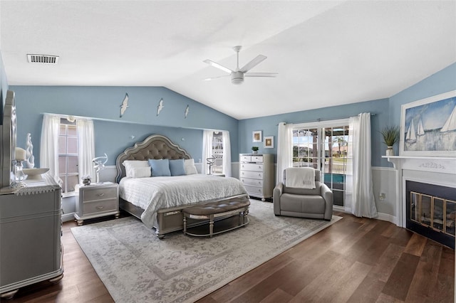 425 Corrientes Cir, Punta Gorda, FL 33983 - bedroom featuring lofted ceiling, wood finished floors, ceiling fan, and a glass covered fireplace
