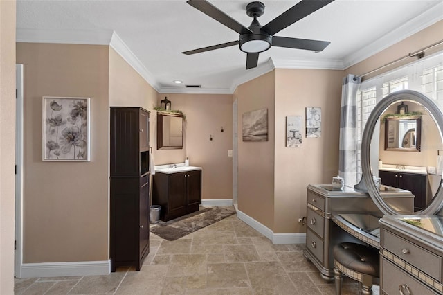 425 Corrientes Cir, Punta Gorda, FL 33983 - bathroom with ceiling fan, baseboards, crown molding, vanity, and stone finish floors