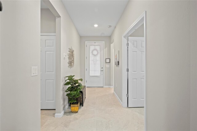 1470 Hyssop Loop, North Port, FL 34289 - hallway with baseboards, light tile patterned floors, and recessed lighting
