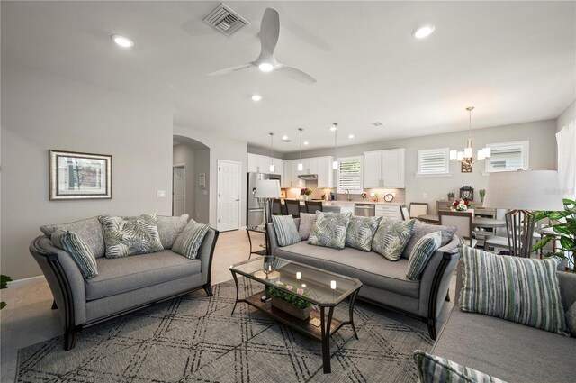 1470 Hyssop Loop, North Port, FL 34289 - living room with arched walkways, a chandelier, recessed lighting, and a ceiling fan