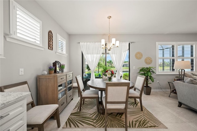 1470 Hyssop Loop, North Port, FL 34289 - dining room featuring a chandelier, plenty of natural light, and baseboards
