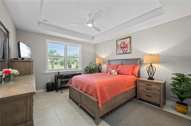 1470 Hyssop Loop, North Port, FL 34289 - bedroom with a tray ceiling, baseboards, light tile patterned floors, and ceiling fan