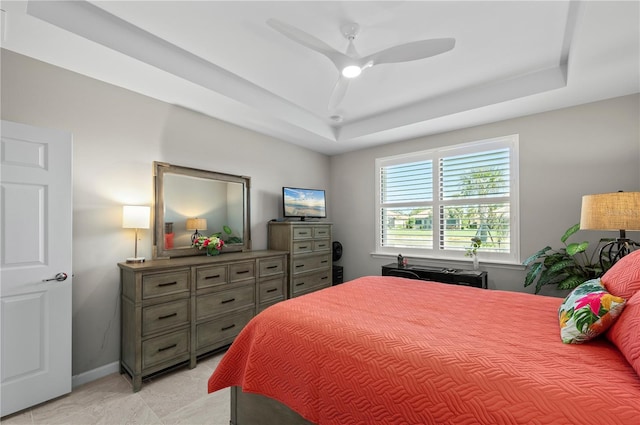 1470 Hyssop Loop, North Port, FL 34289 - bedroom featuring a tray ceiling, ceiling fan, and baseboards