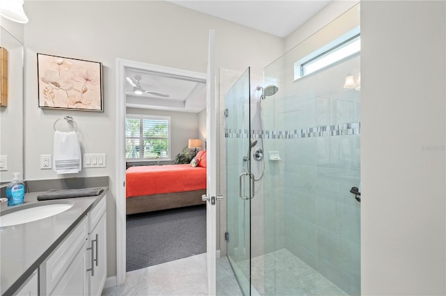 1470 Hyssop Loop, North Port, FL 34289 - ensuite bathroom with vanity, a stall shower, and ceiling fan