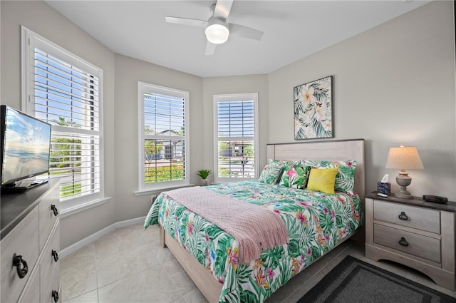 1470 Hyssop Loop, North Port, FL 34289 - bedroom with baseboards, light tile patterned floors, and ceiling fan