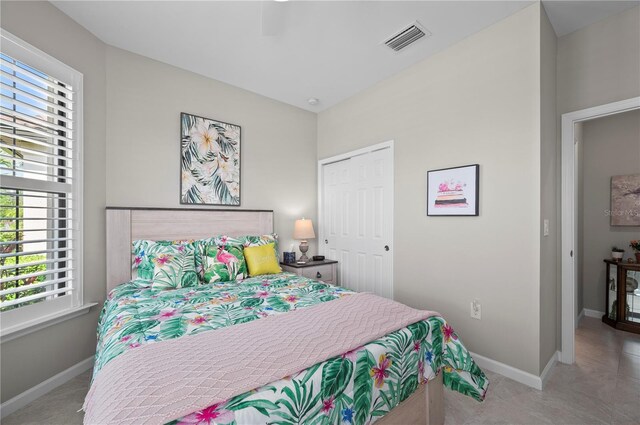 1470 Hyssop Loop, North Port, FL 34289 - carpeted bedroom with multiple windows, a closet, and baseboards
