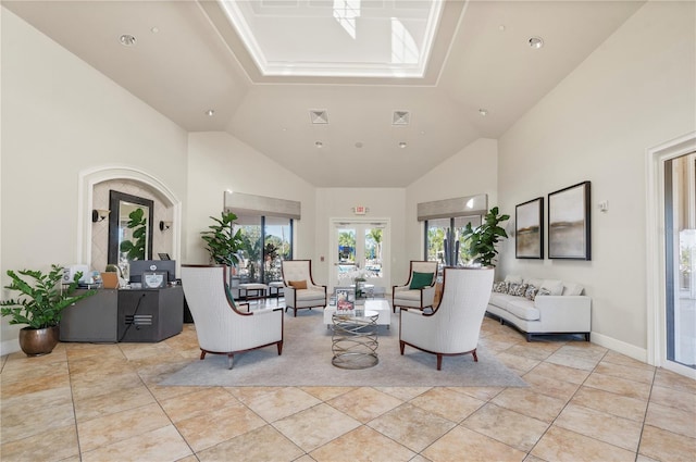 1470 Hyssop Loop, North Port, FL 34289 - living room featuring high vaulted ceiling, light tile patterned flooring, and baseboards