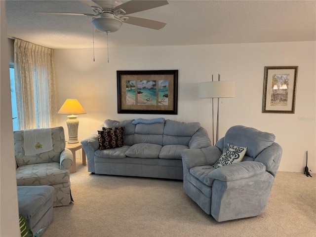 2437 Harbor Blvd Unit 106, Port Charlotte, FL 33952 - living area featuring carpet, ceiling fan, and a textured ceiling