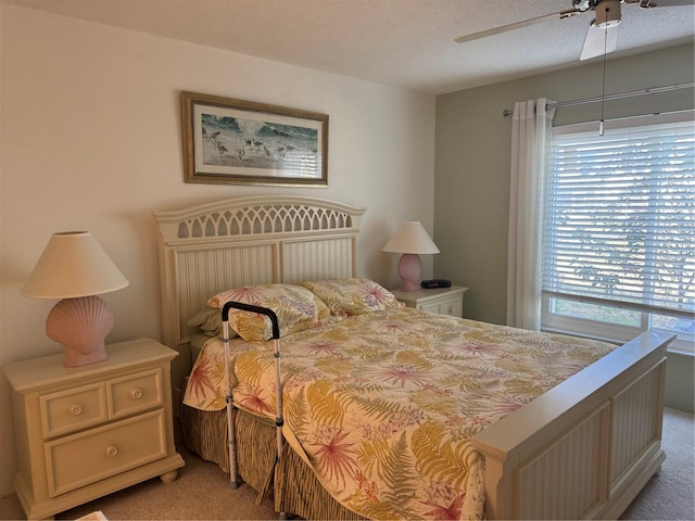 2437 Harbor Blvd Unit 106, Port Charlotte, FL 33952 - bedroom with light colored carpet, ceiling fan, and a textured ceiling