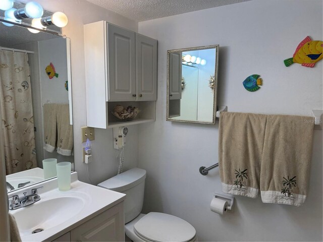 2437 Harbor Blvd Unit 106, Port Charlotte, FL 33952 - full bathroom with toilet, a textured ceiling, vanity, and a shower with shower curtain
