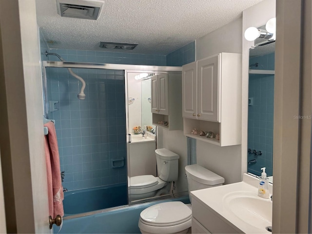 2437 Harbor Blvd Unit 106, Port Charlotte, FL 33952 - full bath featuring toilet, vanity, a textured ceiling, and bath / shower combo with glass door