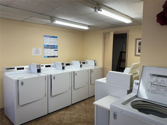 2437 Harbor Blvd Unit 106, Port Charlotte, FL 33952 - communal laundry room with washer and clothes dryer and tile patterned floors