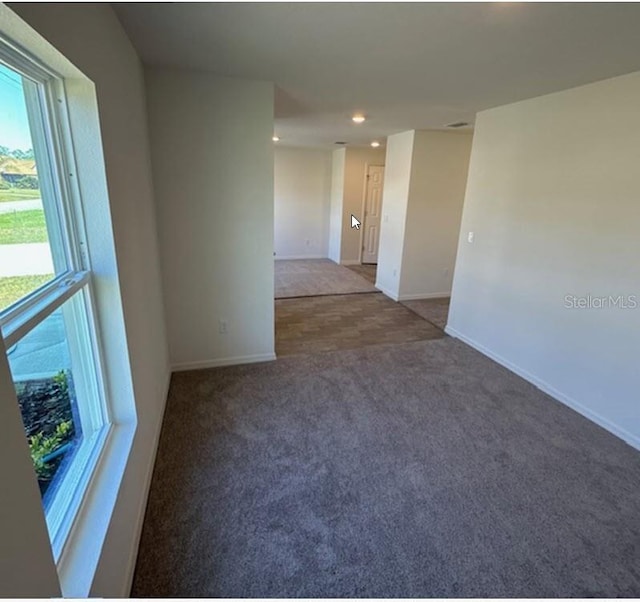 42 Peppercorn Ln, Palm Coast, FL 32164 - empty room featuring carpet flooring, baseboards, and recessed lighting