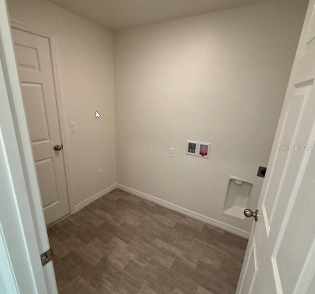 42 Peppercorn Ln, Palm Coast, FL 32164 - washroom featuring washer hookup, electric dryer hookup, wood finished floors, and baseboards