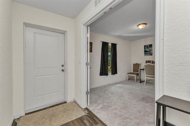 3799 Laredo Ave, North Port, FL 34288 - entrance foyer with baseboards, wood finished floors, and a textured wall