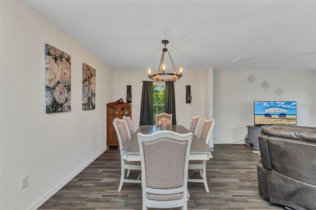 3799 Laredo Ave, North Port, FL 34288 - dining area featuring a chandelier, wood finished floors, and baseboards