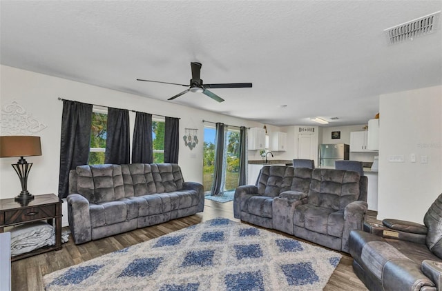 3799 Laredo Ave, North Port, FL 34288 - living room featuring ceiling fan and wood finished floors