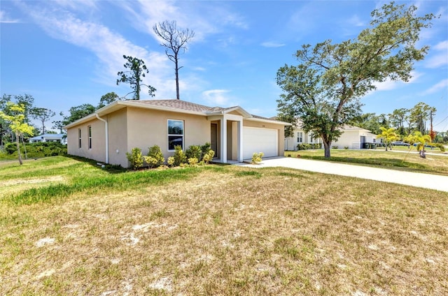 3799 Laredo Ave, North Port, FL 34288 - single story home featuring stucco siding, concrete driveway, an attached garage, and a front lawn