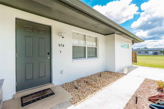 416 Allen St, Punta Gorda, FL 33950 - property entrance featuring stucco siding