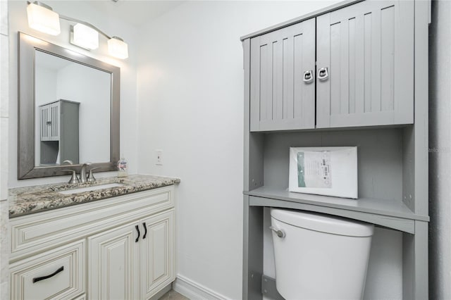 416 Allen St, Punta Gorda, FL 33950 - bathroom with vanity, toilet, and baseboards
