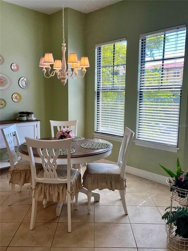 96 Vivante Blvd Unit 9622, Punta Gorda, FL 33950 - dining space with a chandelier, light tile patterned flooring, healthy amount of natural light, and baseboards