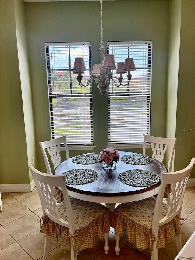 96 Vivante Blvd Unit 9622, Punta Gorda, FL 33950 - dining room featuring a chandelier, light tile patterned flooring, baseboards, and plenty of natural light