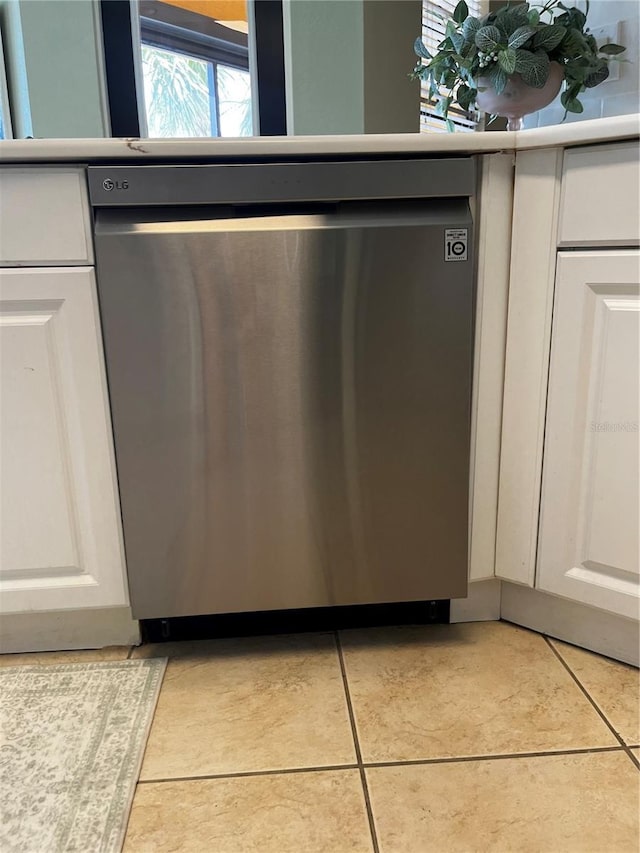 96 Vivante Blvd Unit 9622, Punta Gorda, FL 33950 - detailed view of stainless steel dishwasher and white cabinets