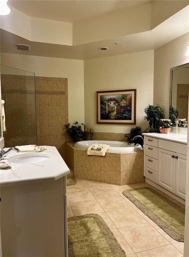 96 Vivante Blvd Unit 9622, Punta Gorda, FL 33950 - bathroom with two vanities, a bath, and tile patterned floors