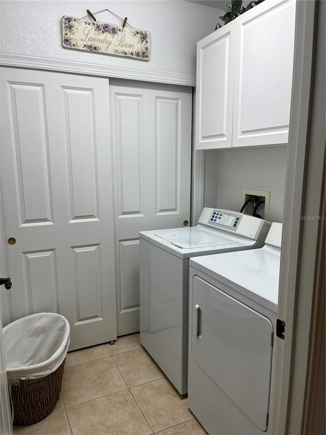 96 Vivante Blvd Unit 9622, Punta Gorda, FL 33950 - washroom with independent washer and dryer, cabinet space, and light tile patterned flooring