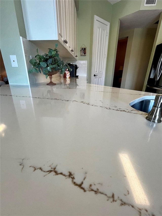 96 Vivante Blvd Unit 9622, Punta Gorda, FL 33950 - kitchen with white cabinetry