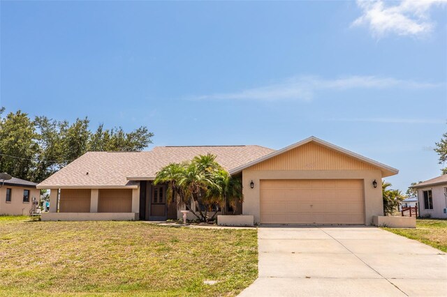 238 Mark Twain Ln, Rotonda West, FL 33947 - single story home with a front yard, an attached garage, concrete driveway, and stucco siding