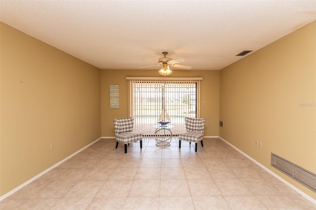 238 Mark Twain Ln, Rotonda West, FL 33947 - living area with ceiling fan, baseboards, and light tile patterned flooring