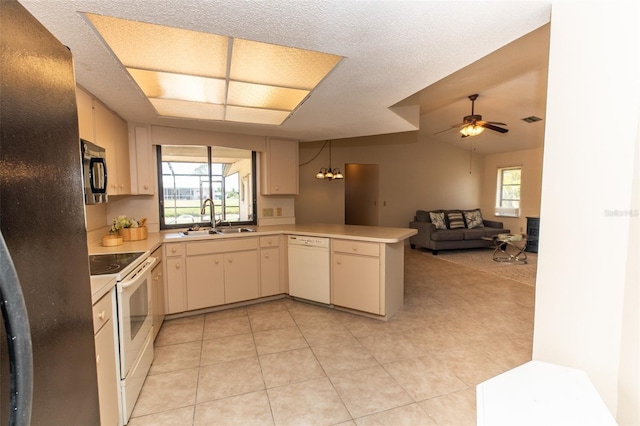 238 Mark Twain Ln, Rotonda West, FL 33947 - kitchen featuring black appliances, a sink, a peninsula, light countertops, and open floor plan