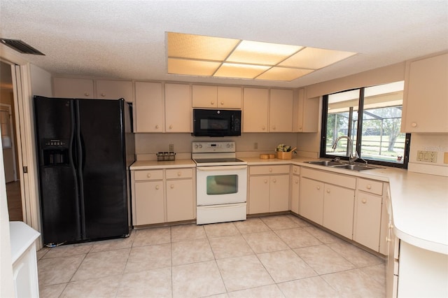 238 Mark Twain Ln, Rotonda West, FL 33947 - kitchen featuring black appliances, a sink, cream cabinetry, light countertops, and light tile patterned floors