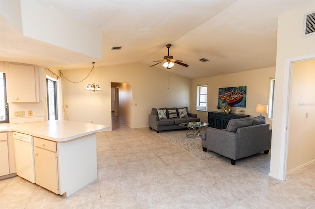 238 Mark Twain Ln, Rotonda West, FL 33947 - living area featuring vaulted ceiling, ceiling fan, light tile patterned floors, and baseboards