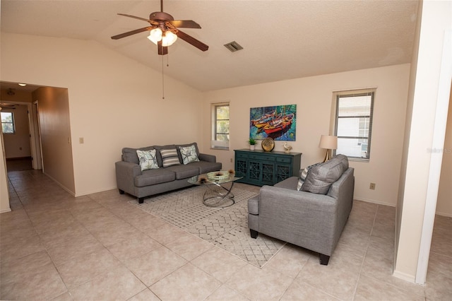238 Mark Twain Ln, Rotonda West, FL 33947 - living area with a ceiling fan, plenty of natural light, lofted ceiling, and light tile patterned flooring