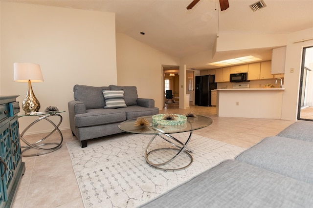 238 Mark Twain Ln, Rotonda West, FL 33947 - living area with vaulted ceiling, light tile patterned floors, and a ceiling fan