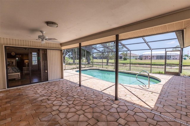 238 Mark Twain Ln, Rotonda West, FL 33947 - outdoor pool featuring a patio area, a ceiling fan, and glass enclosure