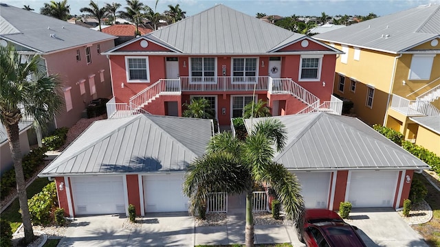 2002 Bal Harbor Blvd Unit 1712, Punta Gorda, FL 33950 - view of front facade with a detached garage, stairs, metal roof, and a standing seam roof
