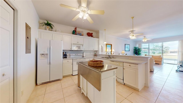 2002 Bal Harbor Blvd Unit 1712, Punta Gorda, FL 33950 - kitchen featuring white appliances, a ceiling fan, a sink, a peninsula, and a center island