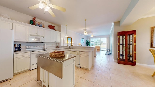 2002 Bal Harbor Blvd Unit 1712, Punta Gorda, FL 33950 - kitchen featuring white appliances, a ceiling fan, a peninsula, a kitchen island, and a sink