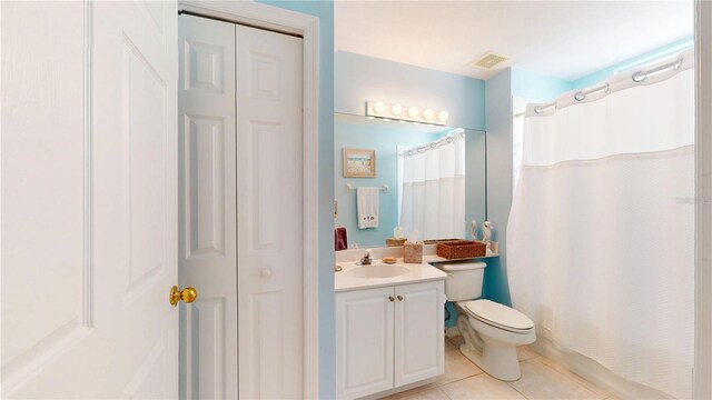 2002 Bal Harbor Blvd Unit 1712, Punta Gorda, FL 33950 - full bath with vanity, tile patterned flooring, a closet, toilet, and a shower with curtain