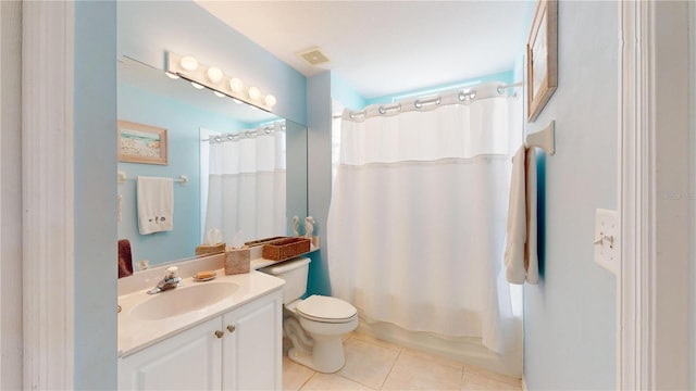 2002 Bal Harbor Blvd Unit 1712, Punta Gorda, FL 33950 - bathroom featuring vanity, toilet, tile patterned floors, and shower / bath combo with shower curtain