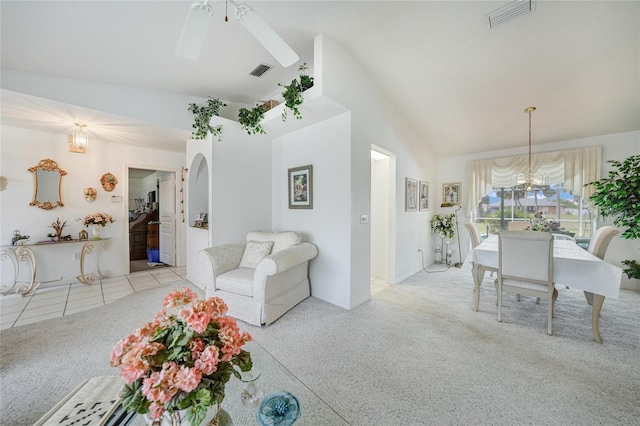 4055 Alwick Ln, North Port, FL 34287 - living room with carpet floors, a ceiling fan, a chandelier, and high vaulted ceiling