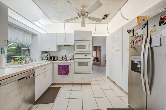 4055 Alwick Ln, North Port, FL 34287 - kitchen with stainless steel appliances, a sink, light countertops, ceiling fan, and under cabinet range hood