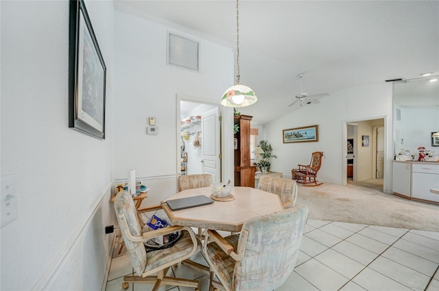 4055 Alwick Ln, North Port, FL 34287 - dining space with light colored carpet, lofted ceiling, ceiling fan, and light tile patterned flooring