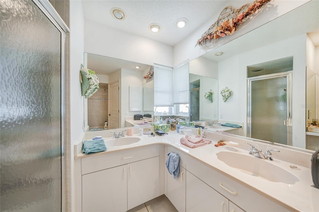 4055 Alwick Ln, North Port, FL 34287 - full bath featuring a shower stall, double vanity, recessed lighting, and tile patterned floors