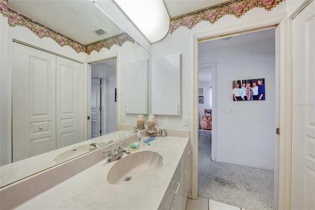 4055 Alwick Ln, North Port, FL 34287 - bathroom with vanity and a textured ceiling
